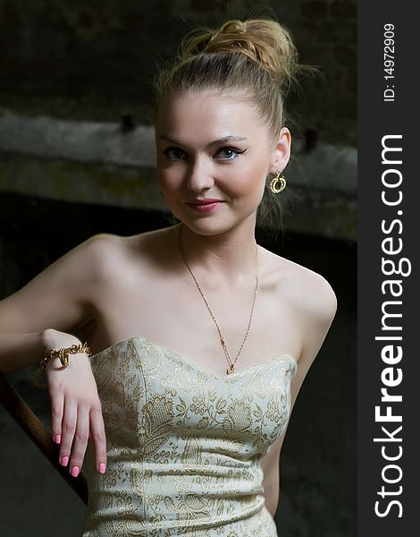 Attractive young lady posing somewhere in industrial ruins. Attractive young lady posing somewhere in industrial ruins