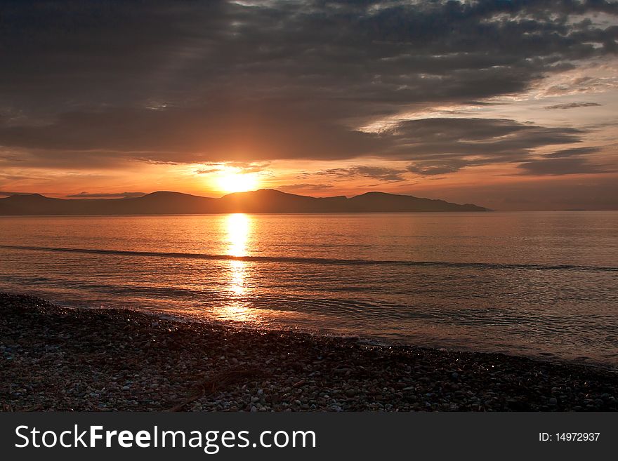 Beautiful sunrise on the coast at Nafplio in Greece. Beautiful sunrise on the coast at Nafplio in Greece