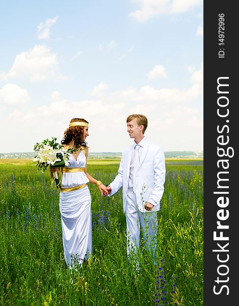 Just married couple on the green field. Just married couple on the green field