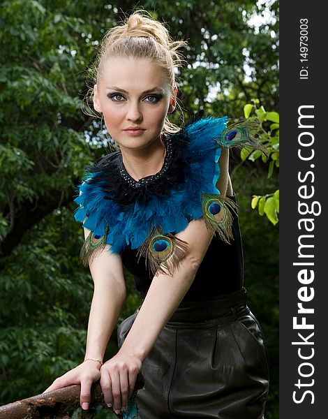 Portrait Of Girl In Blouse With Peacock Feathers