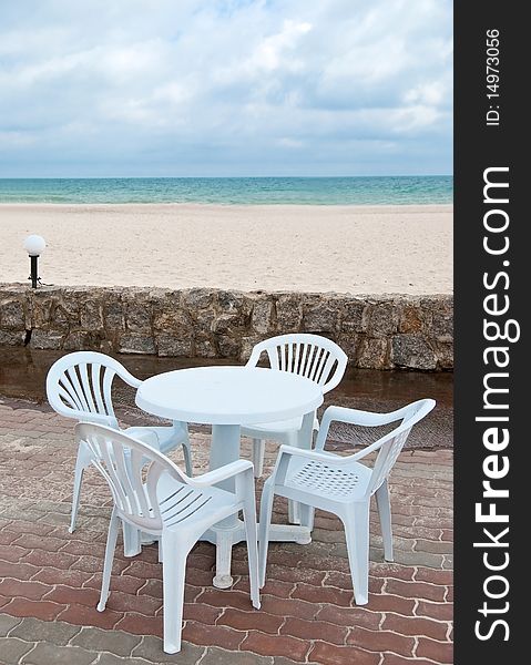 Empty table and chairs in the beach near sea. Empty table and chairs in the beach near sea