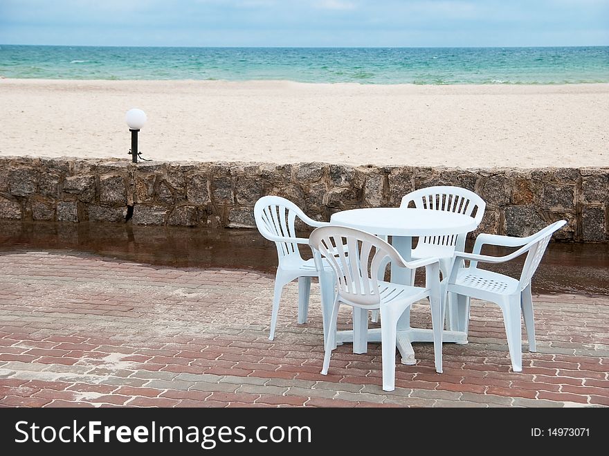 Empty table and chairs in the beach near sea. Empty table and chairs in the beach near sea