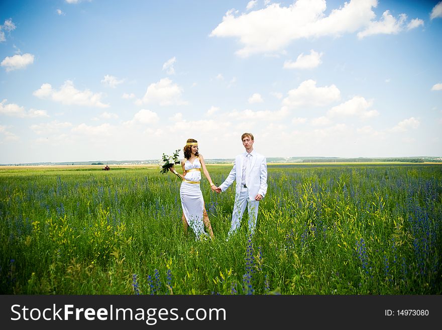 Just married couple on the green field. Just married couple on the green field