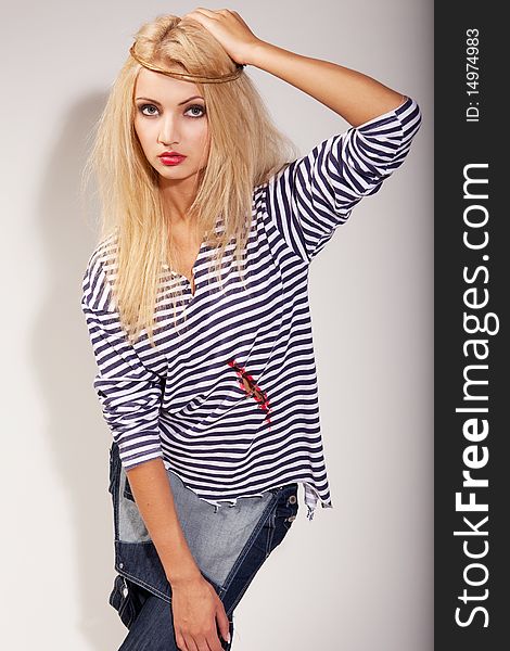 Beautiful blond woman in sailor shirt with collar on her nead. Beautiful blond woman in sailor shirt with collar on her nead