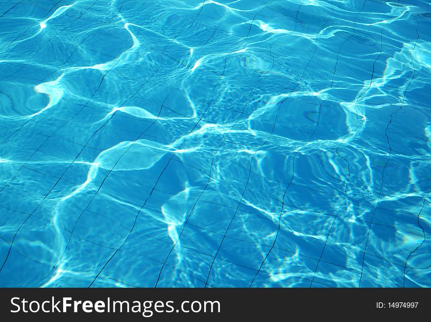 Blue fresh vibrant water in swimming pool. Blue fresh vibrant water in swimming pool