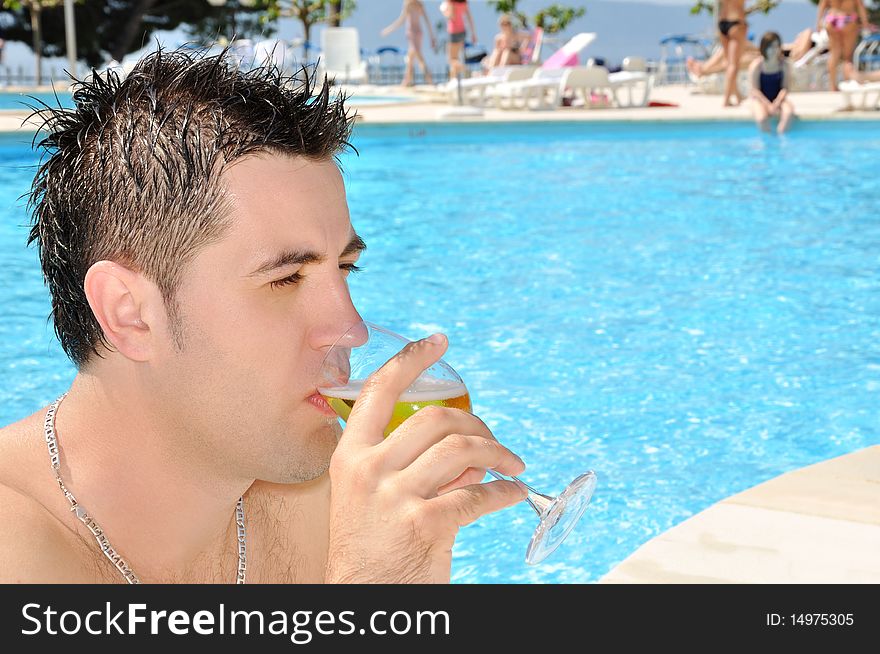 Young Man Drinking Glass Of Beer