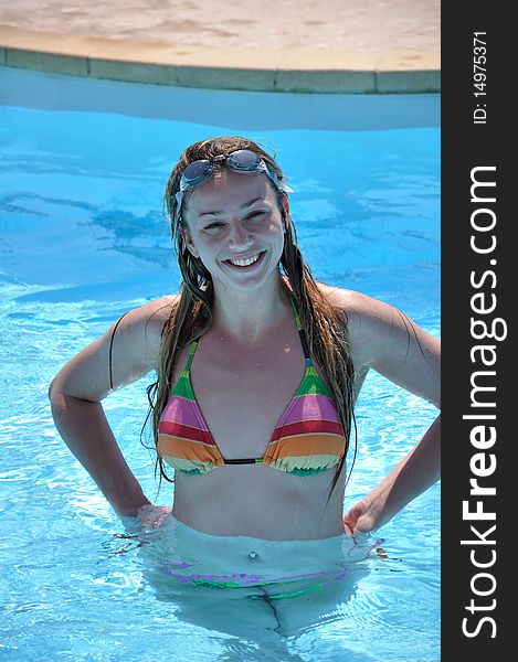 Beautiful woman at the swimming pool