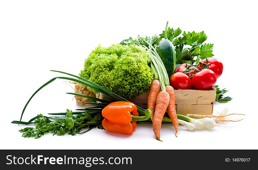 Juicy vegetables in punnet on white background