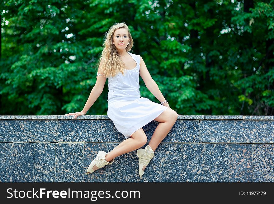 Beautiful young woman relaxing in park