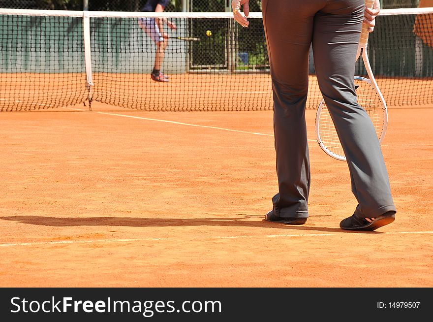 Young female playing tennis