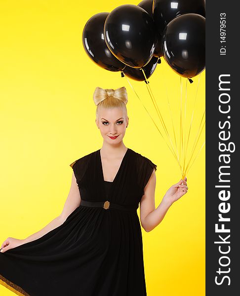 Lovely lady with black balloons