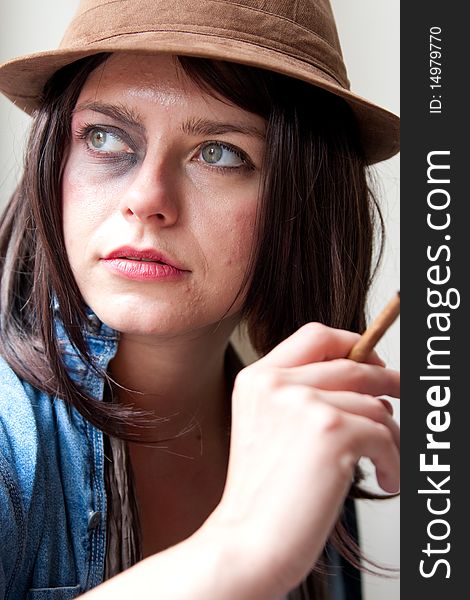 Fashionable Young Woman with Bruised Eye Smoking Cigar
