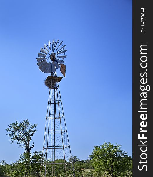 Windmill in a rural farm. Windmill in a rural farm