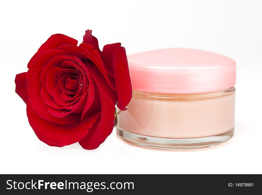 Closeup of jar of moisturizing face cream and fresh red rose. Closeup of jar of moisturizing face cream and fresh red rose