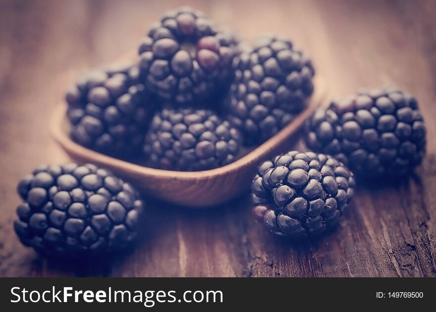 Fresh blackberries on wooden surface