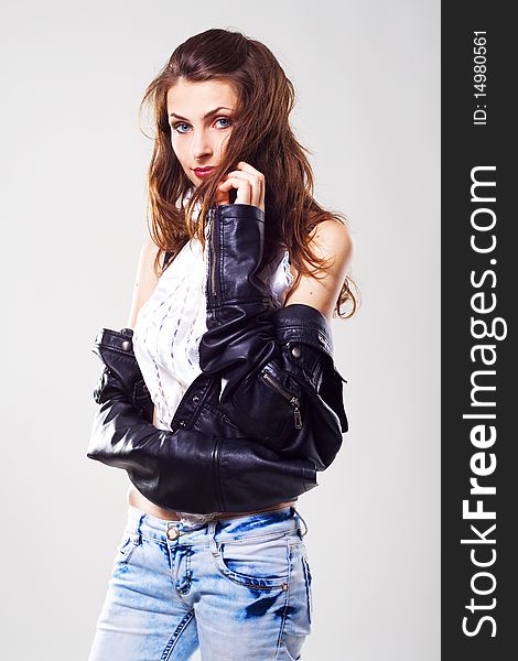 Stylish seductive model in a leather jacket