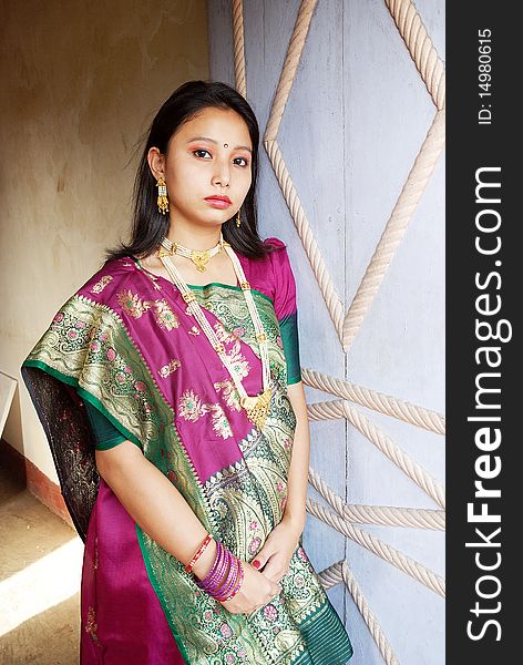 A young Indian woman with traditional Saree