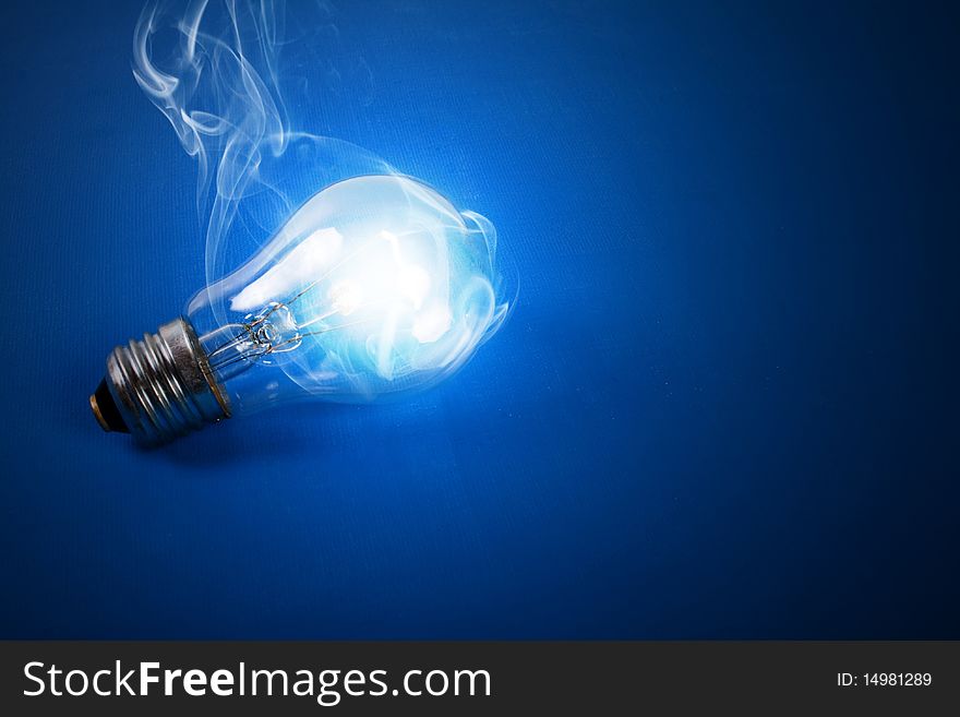shone electric bulb on a dark blue background. shone electric bulb on a dark blue background