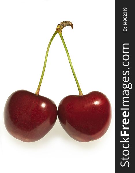 Pair of red cherries in classic pose