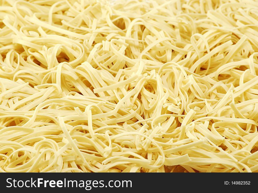 Yellow wheat pasta detail background
