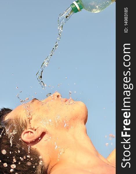 A young man pours water