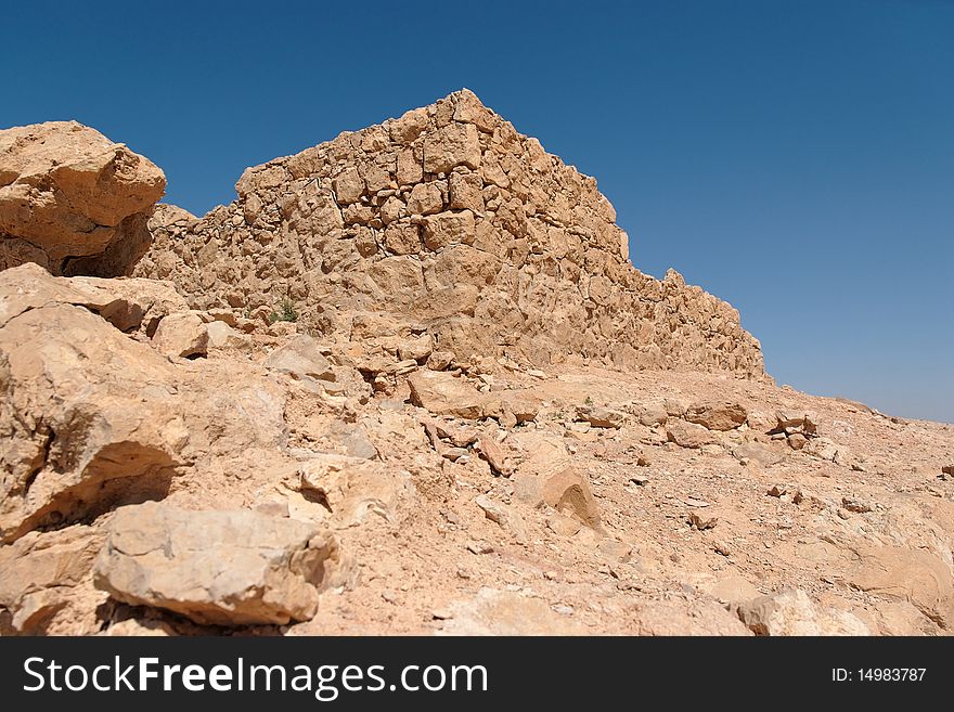 Ruins of ancient stone tower on the hill in Masada fortress in Israel