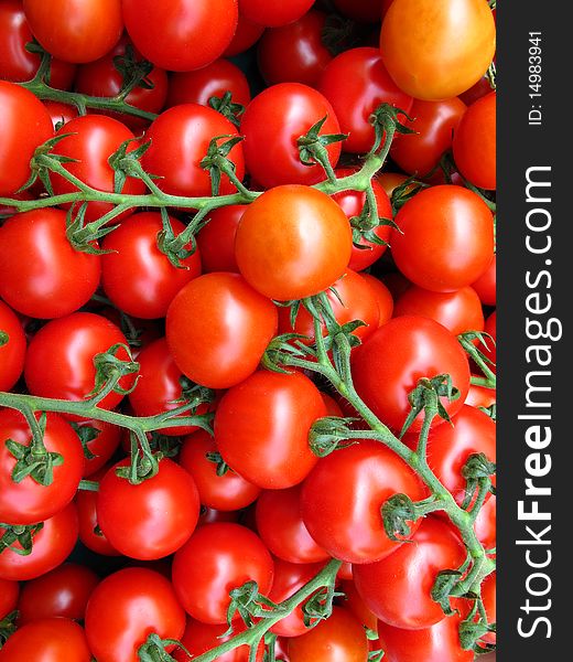 Red vine tomatoes offered on a market