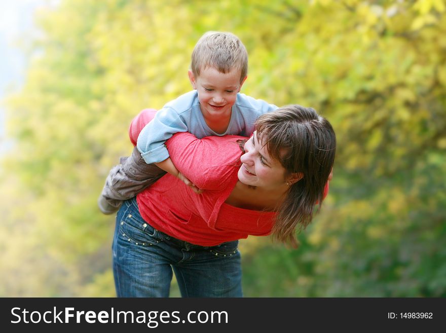 Mother Playing With Son Outdoors