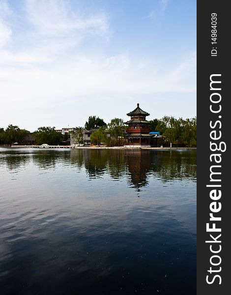 View of lake and ancient tower in Beijing, close to Forbidden City. View of lake and ancient tower in Beijing, close to Forbidden City