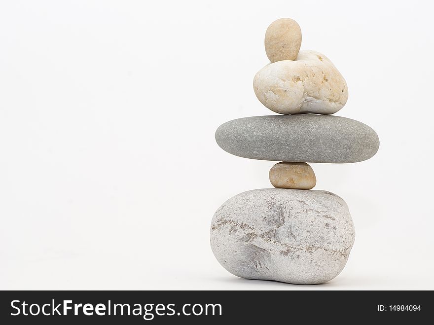 Balanced tower of stones on isolate background