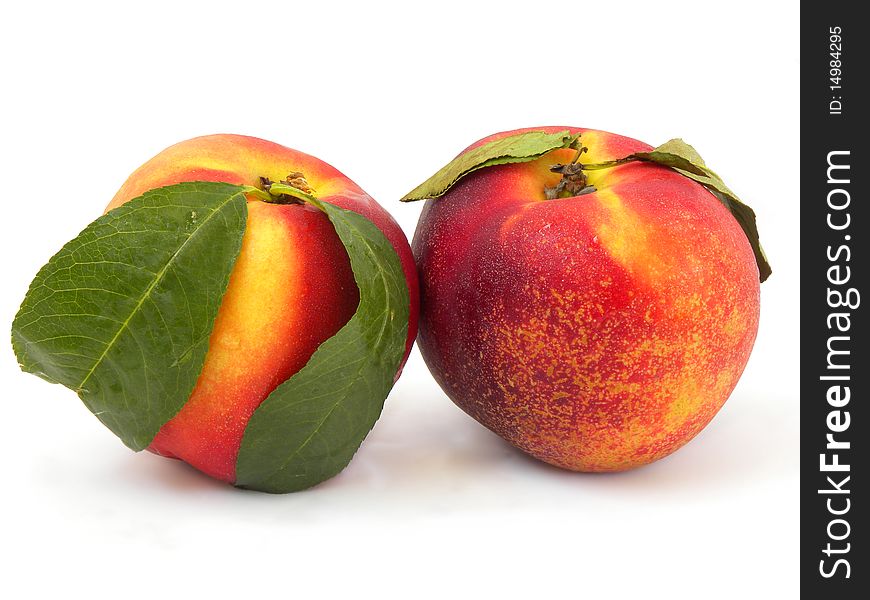 Juicy peaches (nectarine) isolated on a white background