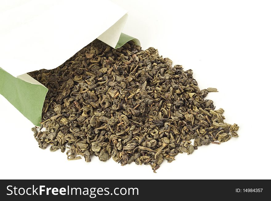 Little bag of dried green tea leaves isolated on white. Little bag of dried green tea leaves isolated on white