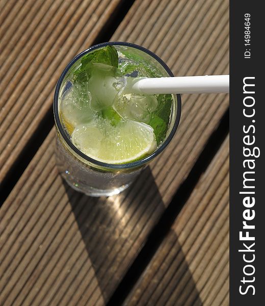 Fresh summer at the beach table cocktail contain ice and mint. Fresh summer at the beach table cocktail contain ice and mint