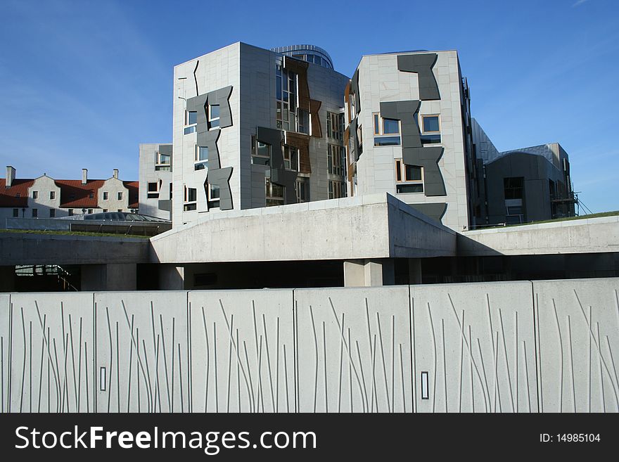 A beautiful and unusual perspective. This is the Scottish Parliament, Royal Mile, Holyrood, Edinburgh. One Side of the building on the high street. Beautiful wall, concrete. Looking from behind parliament with Arthur's Seat at my back and the building between me and the Royal Mile. A beautiful and unusual perspective. This is the Scottish Parliament, Royal Mile, Holyrood, Edinburgh. One Side of the building on the high street. Beautiful wall, concrete. Looking from behind parliament with Arthur's Seat at my back and the building between me and the Royal Mile