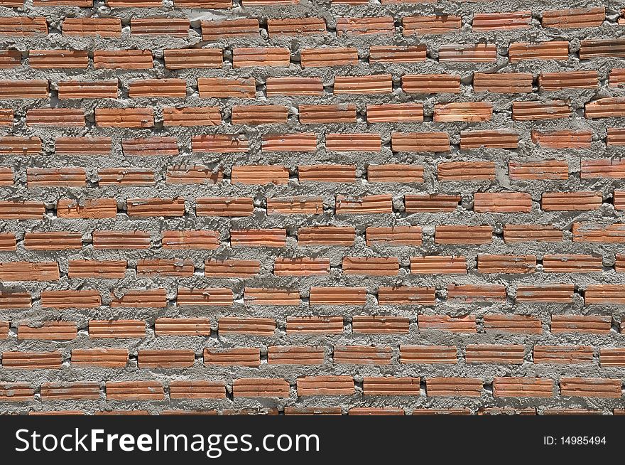 Brown color brick wall in the similar pattern. Brown color brick wall in the similar pattern