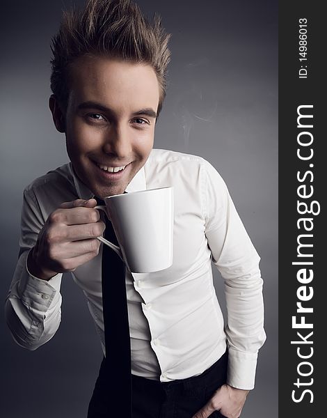 Young attractive macho drinking coffe. photo