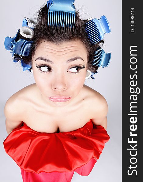 Emotional Girl with hair-curlers on her head