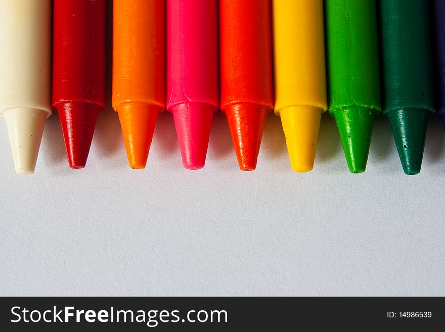 Colorful Crayons on white background.