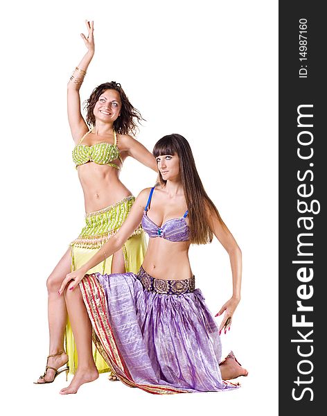 Two young Belly dancers posing sitting on the floor
