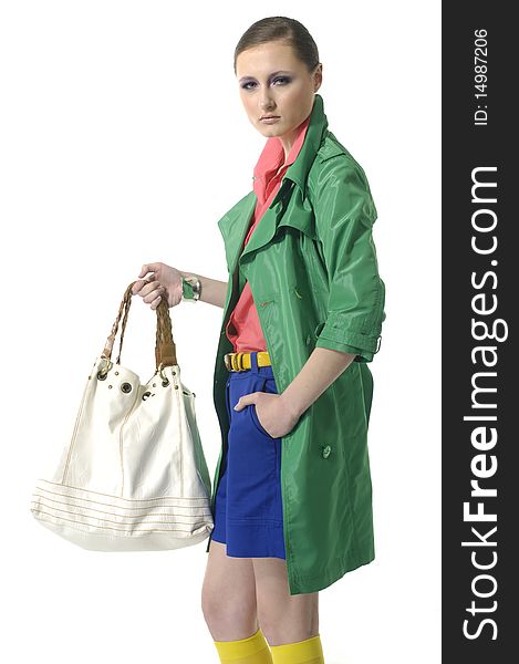 Fashion model with bag posing in the studio