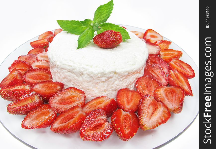 Strawberry dessert with dairy pudding and mint