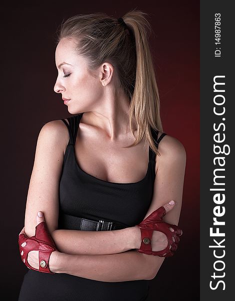 Attractive Posing Blonde In A Red Sport Gloves