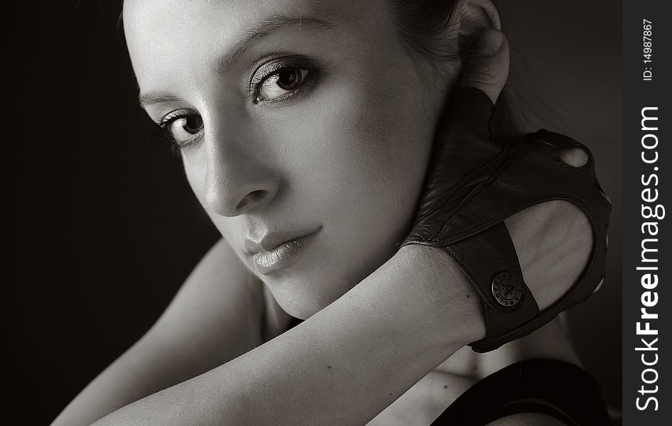 Portrait of attractive young blond girl in sports gloves. Black&White photo.