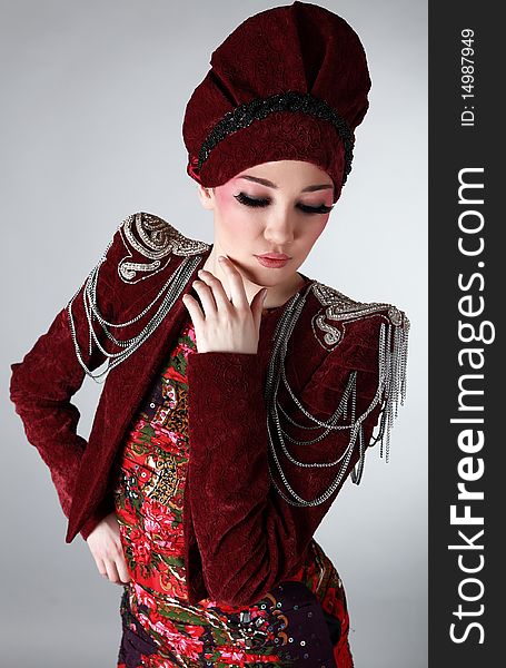 Attractive model in exclusive design clothes on manners old-slavic. Photo.