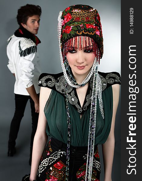 Pair models in exclusive design clothes on manners old-slavic. Photo.