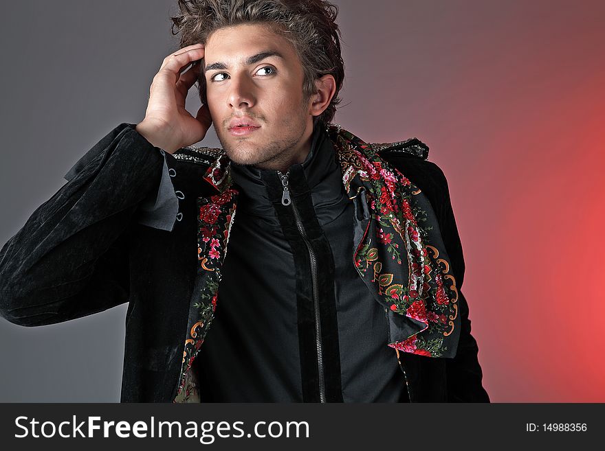 Beautiful man in exclusive design clothes on manners old-slavic. Photo.