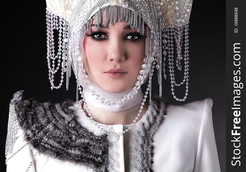 Attractive model in exclusive design clothes on manners old-slavic. Photo.