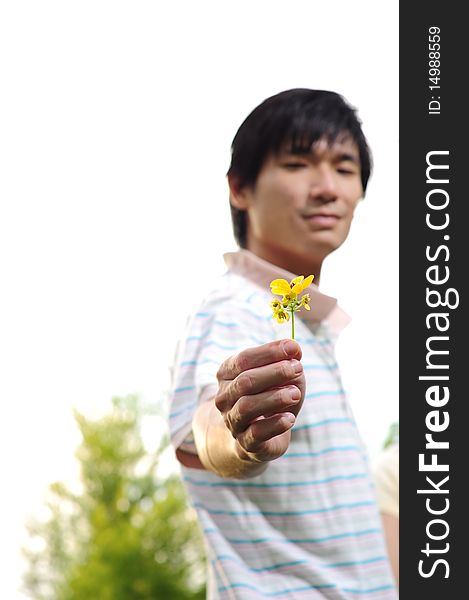 Young Asian Man Proposing With Flower