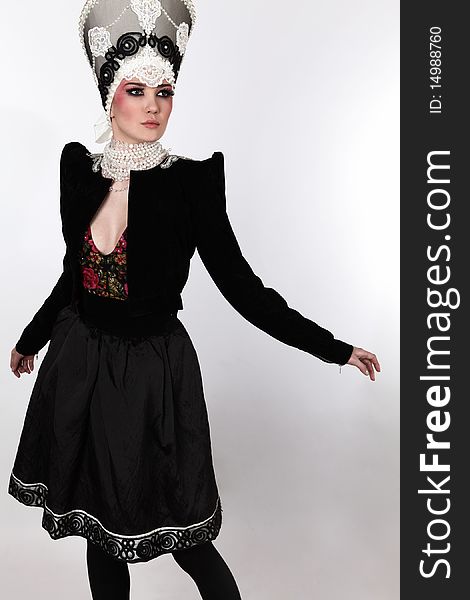 Attractive model in exclusive design clothes on manners old-slavic. Photo.