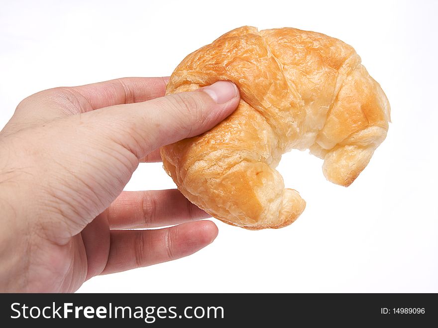 Croissant in hand object on isolated high angle shot. Croissant in hand object on isolated high angle shot